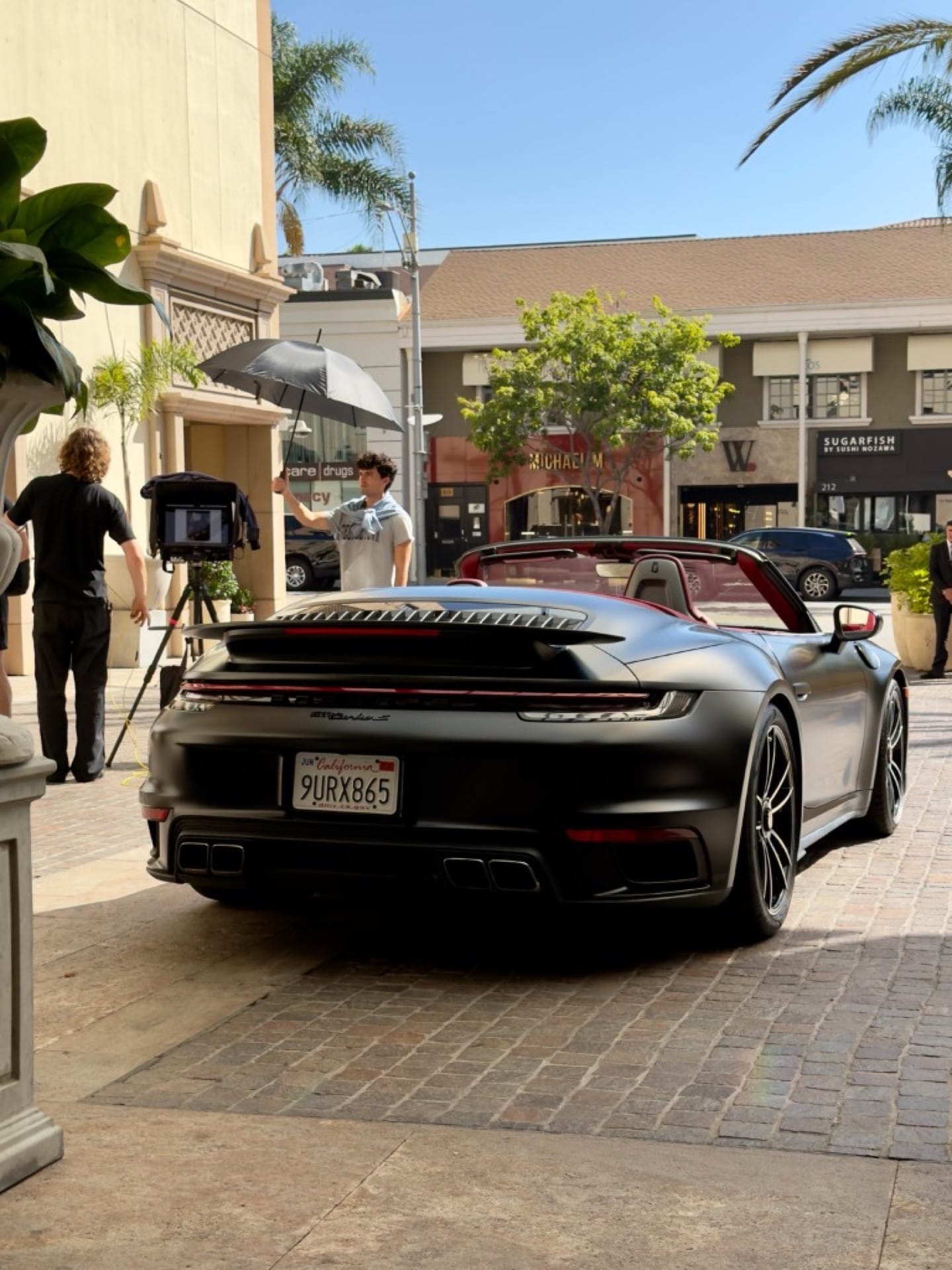 Satin black Porsche 911 Turbo S picture car filmed on a Beverly Hills commercial shoot