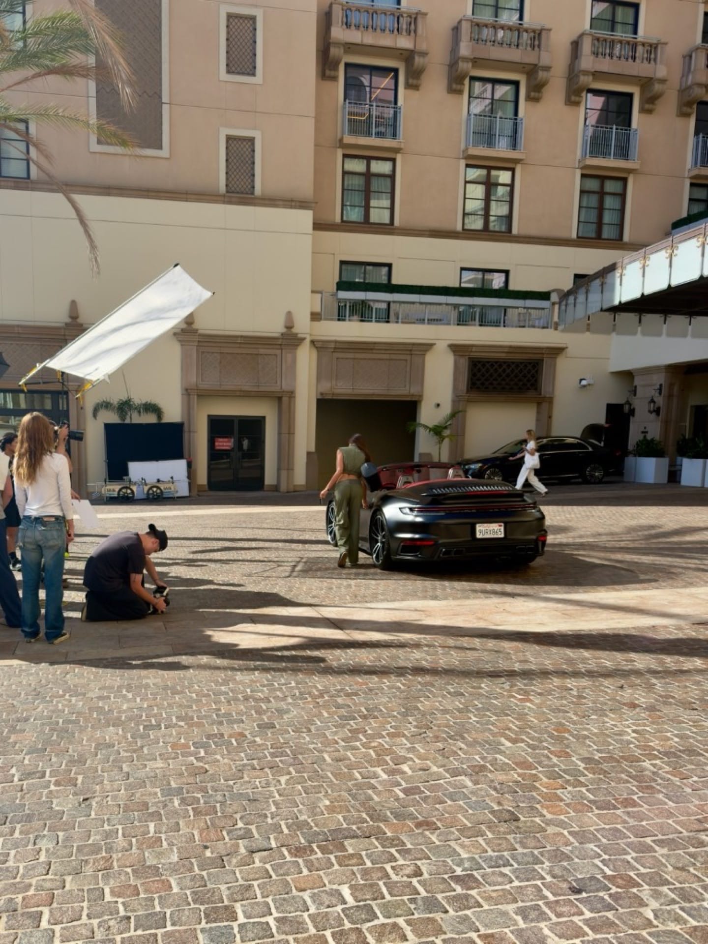 2022 Porsche 911 Turbo S Cabriolet on a luxury activewear commercial production in Beverly Hills
